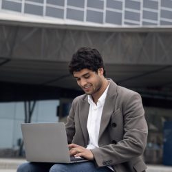 medium-shot-man-working-laptop